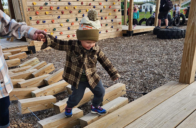 767x500_Fall_BoyClimbingStructure